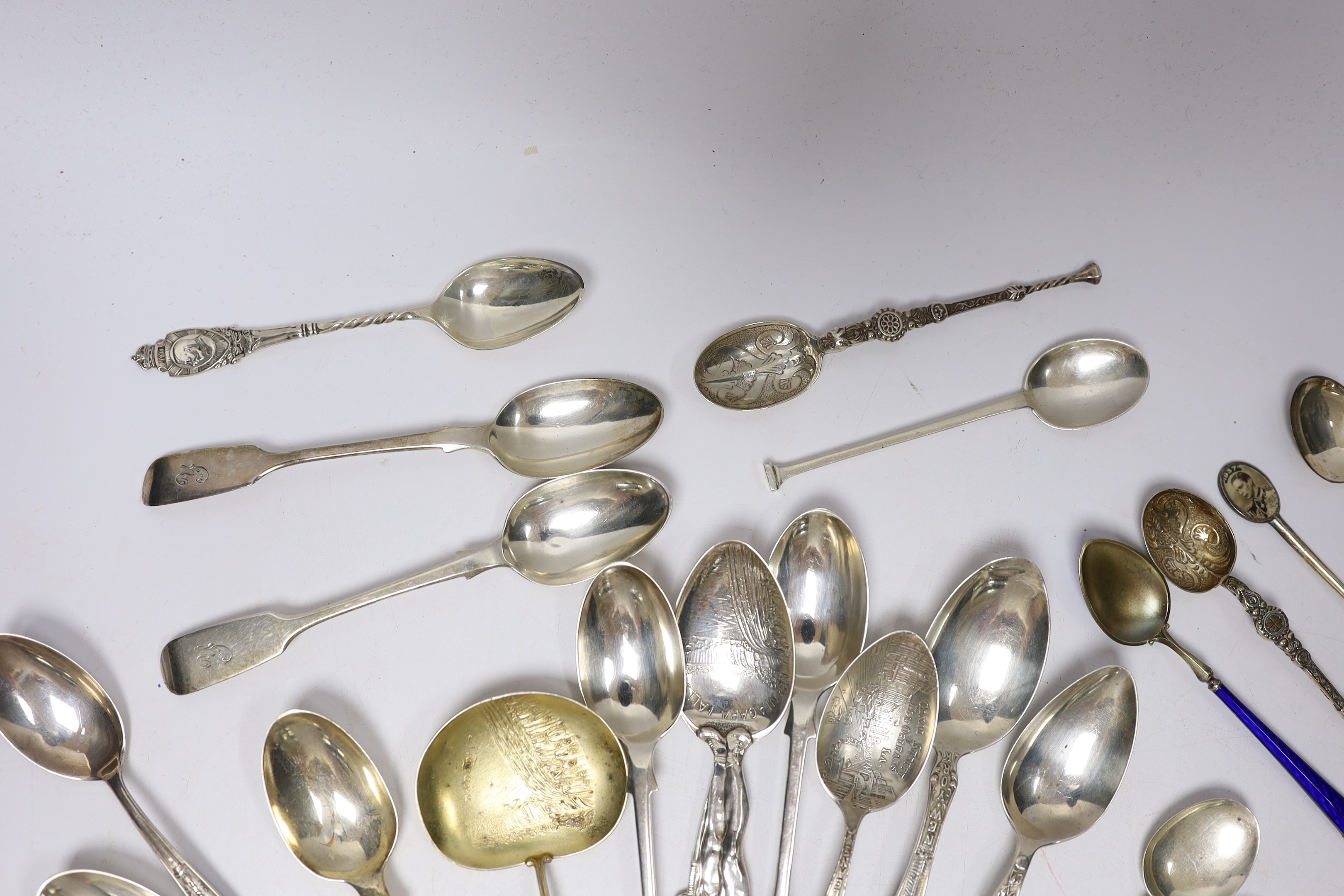 A small group of assorted silver and sterling small spoons, including commemorative etc. and some continental white metal spoons.
